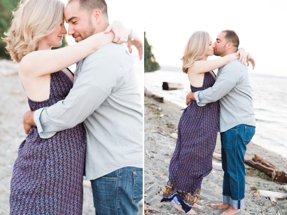 A couple embrace on the beach during their maternity photo session 