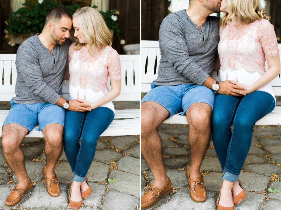 A pregnant couple pose for their maternity session wearing casual clothing