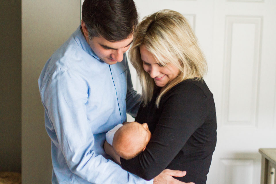 Seattle parents admire their new babies features during their photo shoot