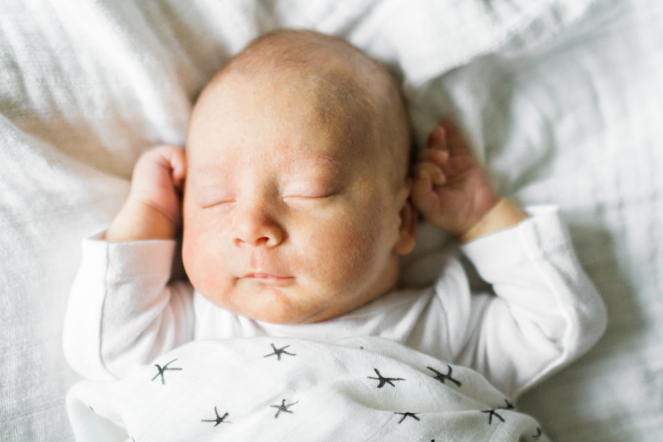  Close up photograph of newborn sleeping baby 
