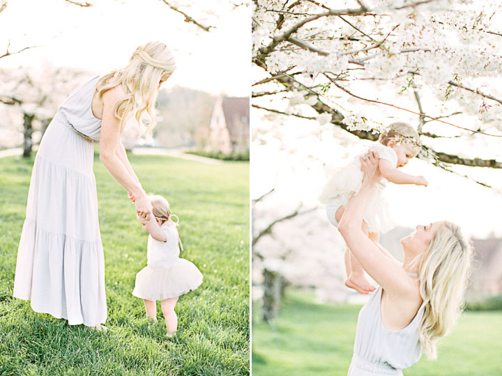 Mom plays with her baby girl as they have their photo taken