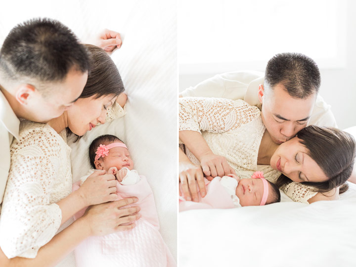 Mom and Dad smile at their new daughter as she lay sleeping