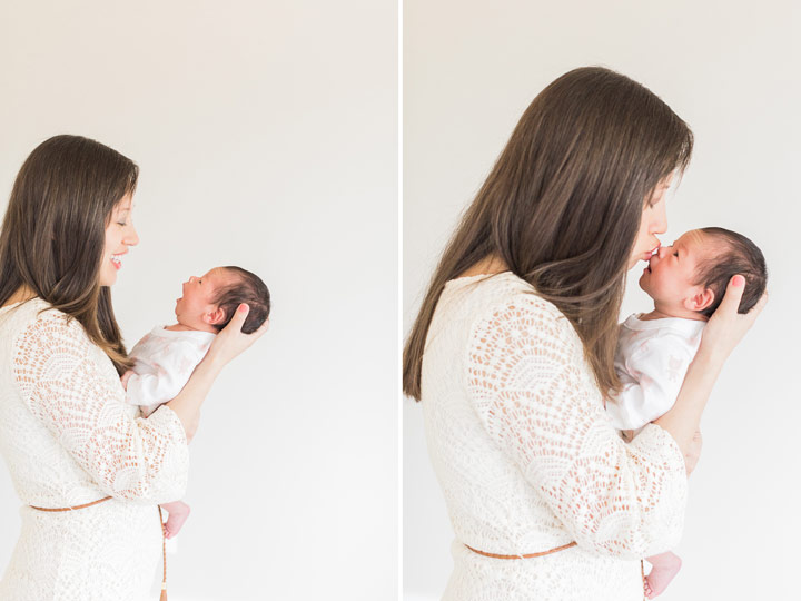 A new Mom stares adoringly at her daughter during their Frisco Newborn Photographer Session