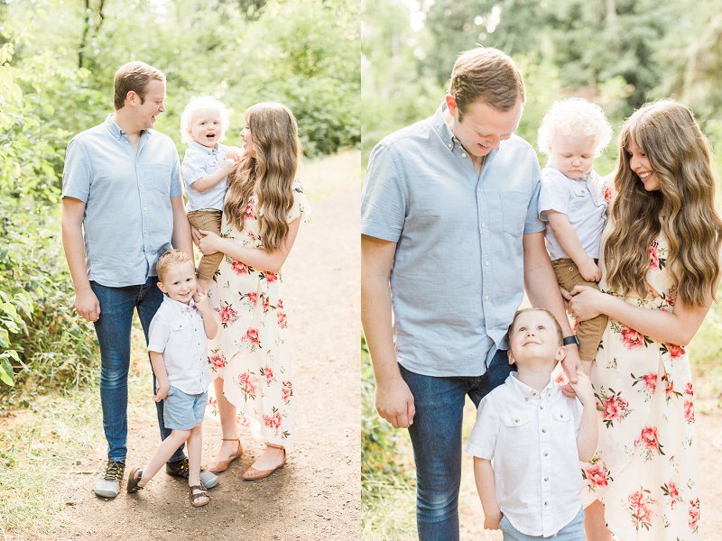 A family of four stands in the woods cuddled together during their Dallas Family Photographer session
