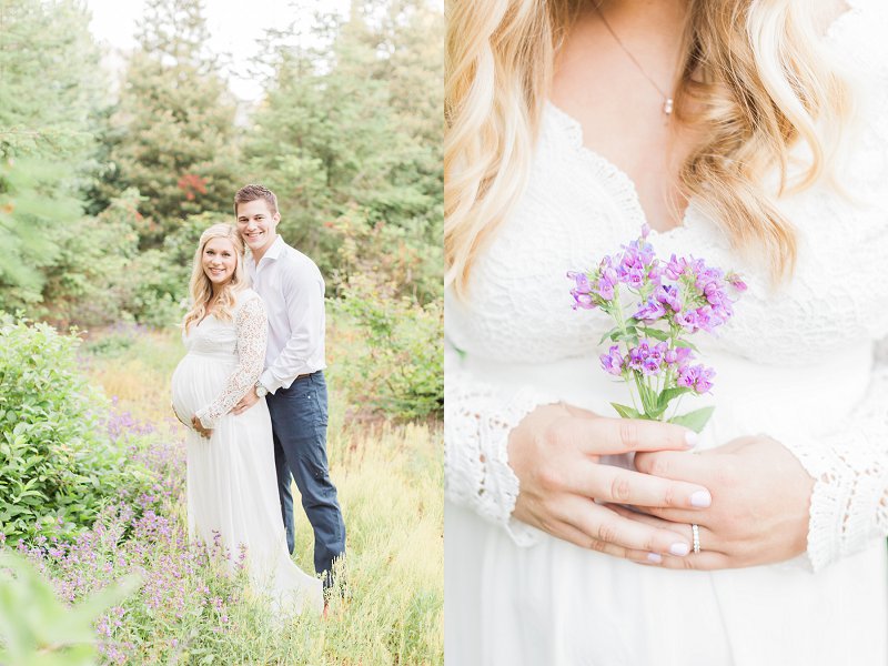 The soon to be Mama holds a small bouquet of purple flowers over her growing baby bump