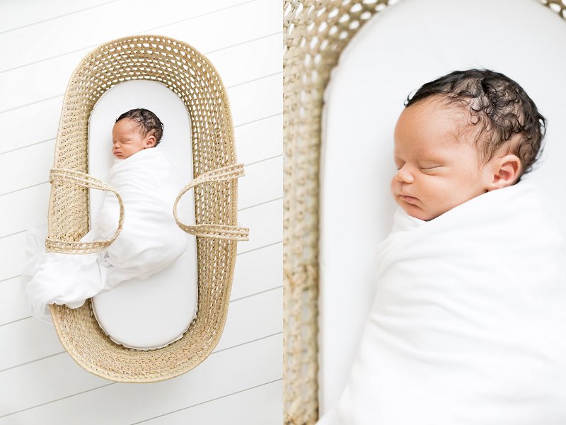 A baby swaddled in a white blanket lays in a Moses basket and sleeps during his Newborn Photography in DFW Session