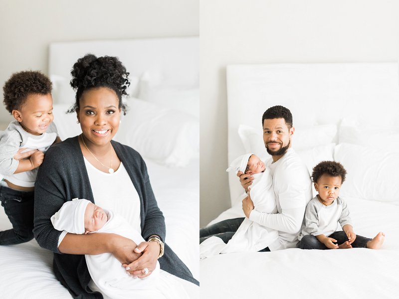 Each parent sits on the bed with both of their children and smiles at the camera 