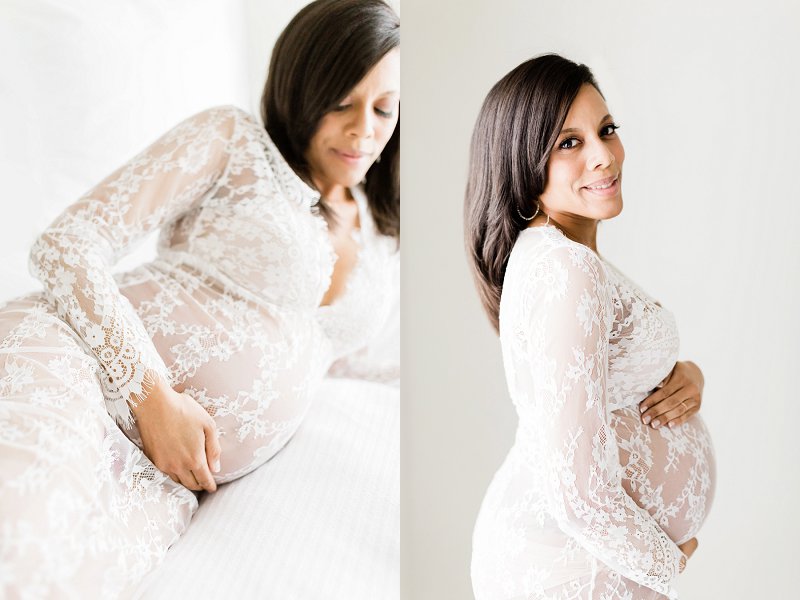 A close up detail photo of a mothers hand resting over her baby bump, dressed all in white