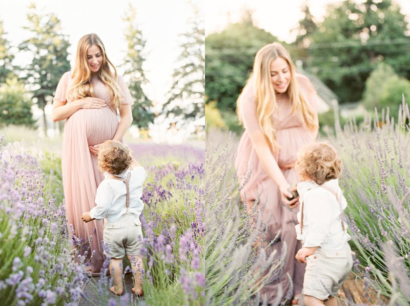 A dreamy film maternity photo of a mother handing a stone to her little boy