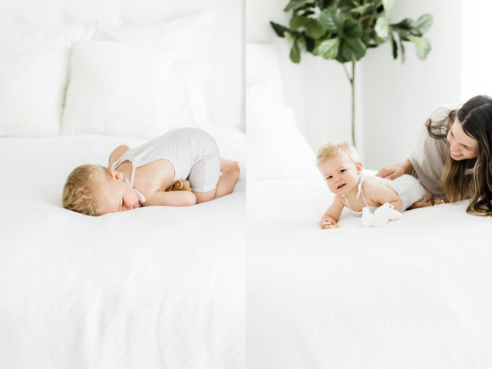 A playful little one curls into a ball on the bed to hide