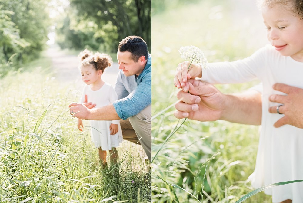 Father and daughter picking wildflowers in gorgeous sunlit field