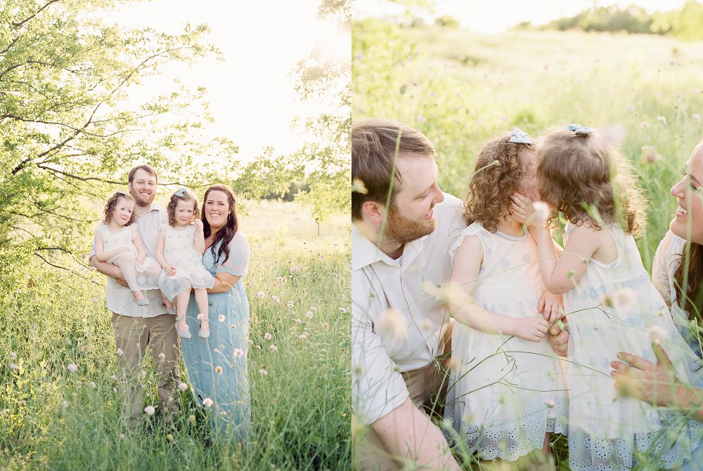A family stands close together in front of a tree while smiling at their Plano Family Photographer